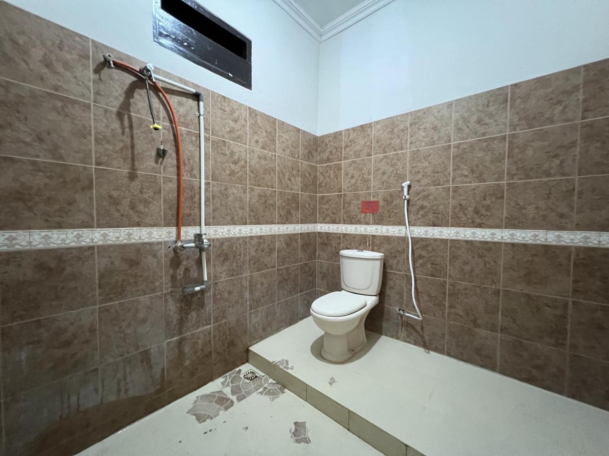 Hotel Oyo 92098 Kost Orange Syariah à Makassar Extérieur photo
